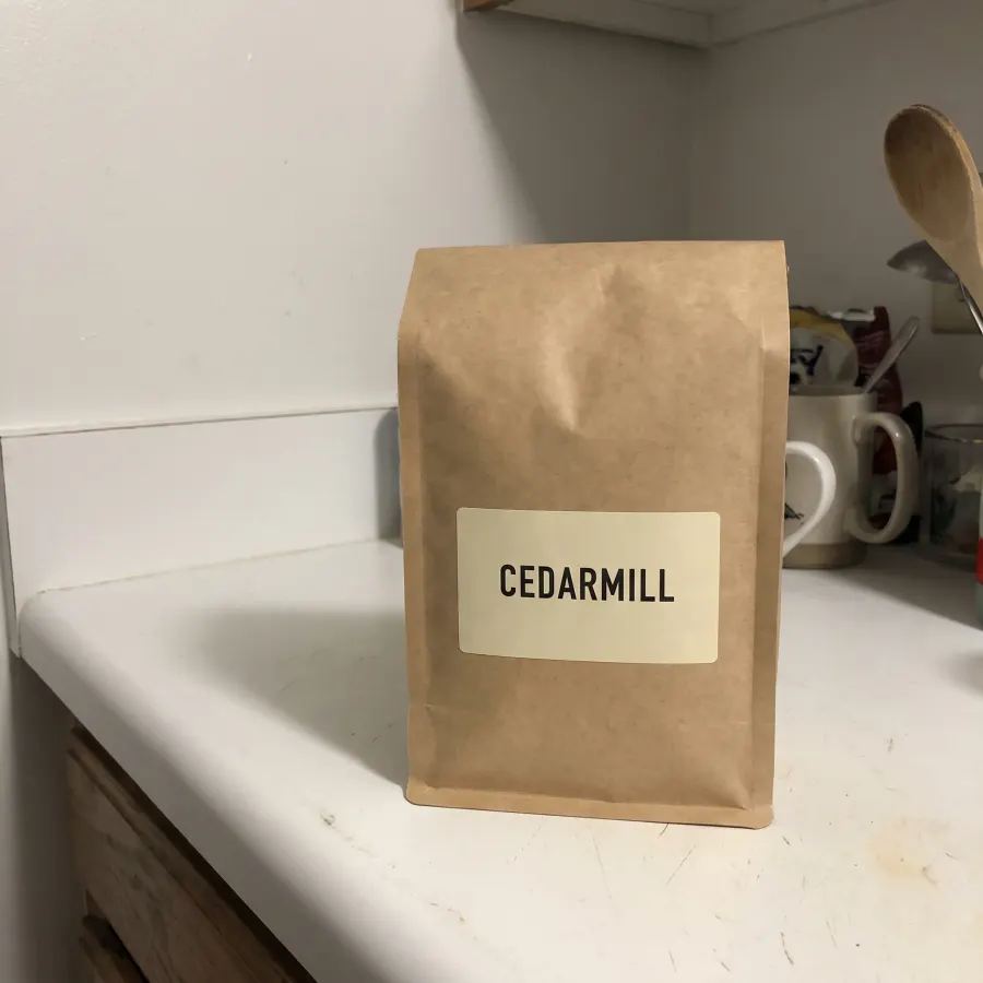 Coffee bag photographed on a kitchen counter with a phone